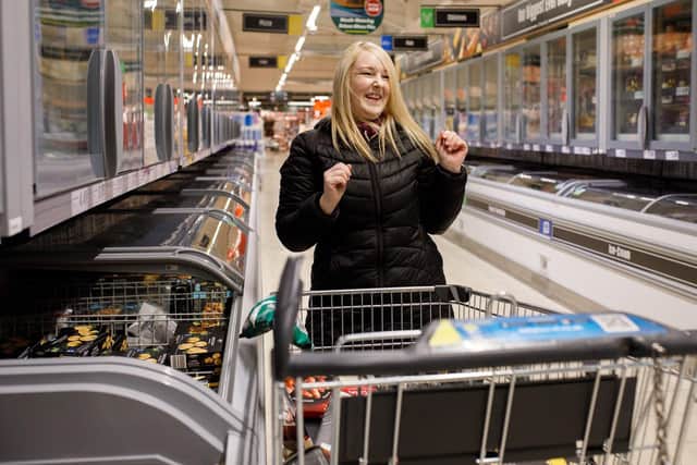 Pictured taking part in the trolley dash in the Lidl Portadown Store is winning customer Jennifer McShane’s daughter Tanya McShane.