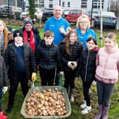 Pictured  with children from Silverstream Primary School  before planting daffodil bulbs are, Louis Richmond, Housing Executive patch manager, Mid and East Antrim; Lorraine Wilson, Housing Executive team leader, Carrick and Larne and Greenisland Community Council members, Maggie Watson, Lisa Morris and Councillor Bobby Hadden. Picture submitted by Housing Executive