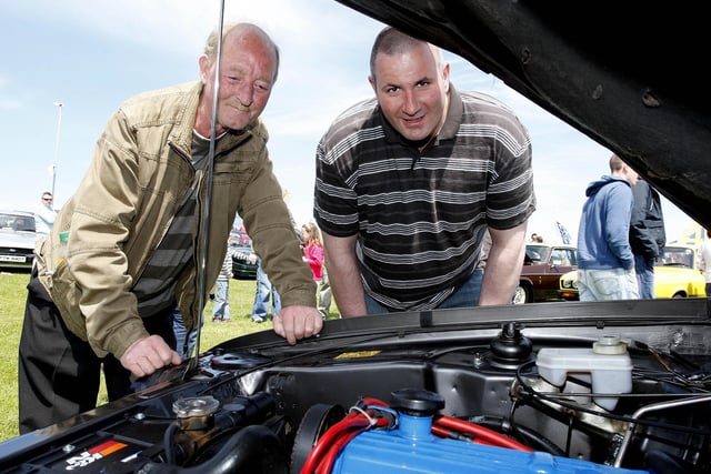 IN GOOD ORDER...Ronnie McBride and John Cochrane look at an engine during the Ford Fair at the Dunluce Centre in 2009.