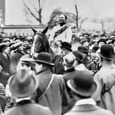 A triumphant Bob Trudgill parading with Master Robert at 1924's Grand National. Credit: Francis X. Murray's private collection