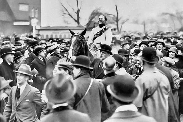 A triumphant Bob Trudgill parading with Master Robert at 1924's Grand National. Credit: Francis X. Murray's private collection
