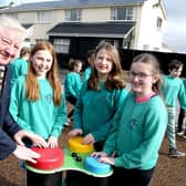Mayor of Causeway Coast and Glens Councillor Steven Callaghan joins with children from St Patrick’s and St Joseph’s PS Garvagh as they enjoy the newly updated Glenullin Play Park.