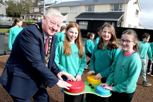 Mayor of Causeway Coast and Glens Councillor Steven Callaghan joins with children from St Patrick’s and St Joseph’s PS Garvagh as they enjoy the newly updated Glenullin Play Park.