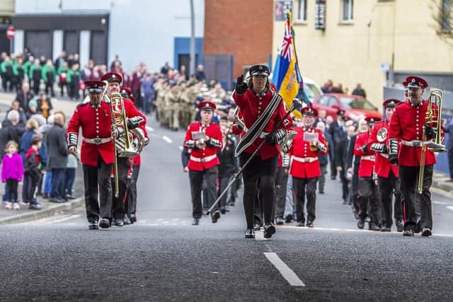 Larne's Remembrance Sunday parade makes its way to the town's War Memorial.
