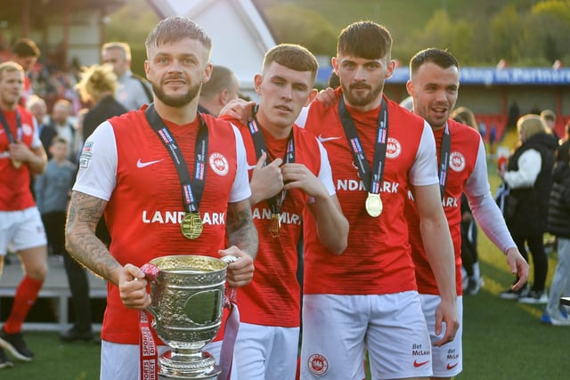 Andy Ryan of Larne enjoys the celebrations.