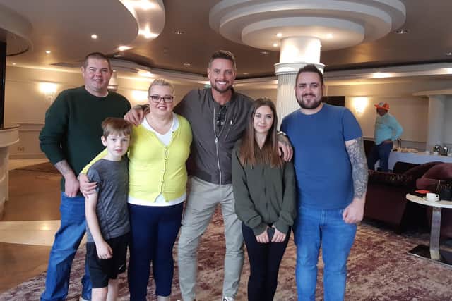 Julia McKeever with her brother Aaron Liggett, her youngest son Joseph McKeever, her granddaughter Aimee O'Hara and her sons Benjamin and Jason O'Hara all with former Boyzone and Coronation Street star Keith Duffy at the Seagoe Hotel in Portadown, Co Armagh where Julia was given a special Community Champion National Lottery award.