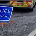 PSNI sign road closed.