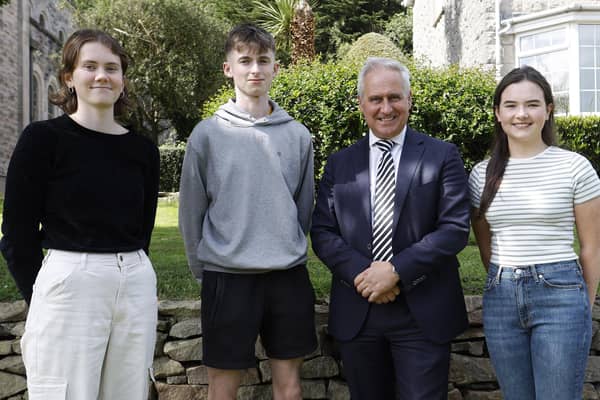 Top achievers Katie Difford with seven A Stars and two A grades, Oran McClintock with seven A Stars and three As and Eleanor Fyfe with seven A Stars and 3 As with Mr Brady.