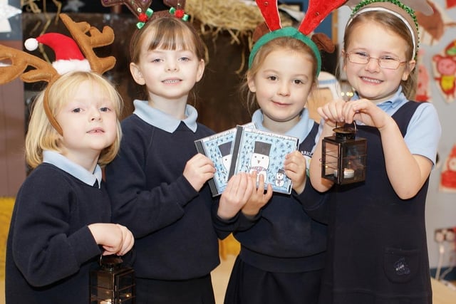 Sophie Brown, Shannon Hastings, Mollie Robinson and Abigail Johnston, from Ballycarrickmaddy Primary School, with copies of a CD the school produced in 2008 of children singing Christmas carols