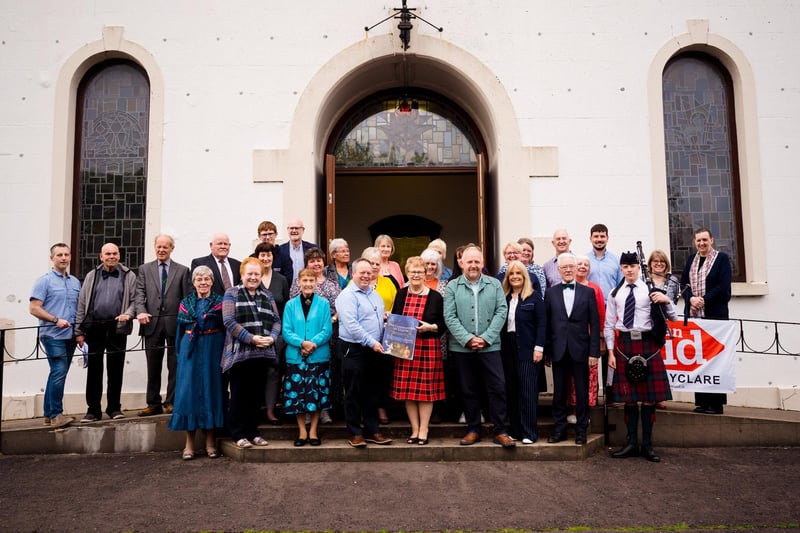 Reverend Jonathan Moxen and Mark Thompson, chairman of the board of directors of Ancestry, with members of the Choir and Praise Band who performed at Ballyclare Presbyterian Church for Songs of Praise: The Ulster-Scots Tradition of Hymn-Writing.