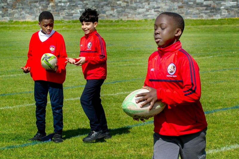 Learning some rugby skills. PT23-242.