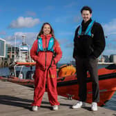 Surfer Matthew Best from Lisburn who was rescued at Benone Beach alongside RNLI Lifeguard Supervisor Annie Jagoe who was involved in his rescue. Pic credit: RNLI