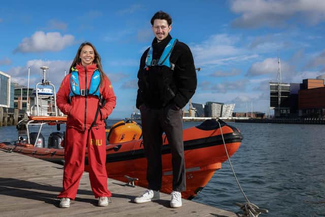 Surfer Matthew Best from Lisburn who was rescued at Benone Beach alongside RNLI Lifeguard Supervisor Annie Jagoe who was involved in his rescue. Pic credit: RNLI