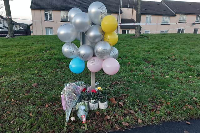 Tributes have been left for 23-year-old Odhrán Kelly at Edward Street in Lurgan, Co Armagh.