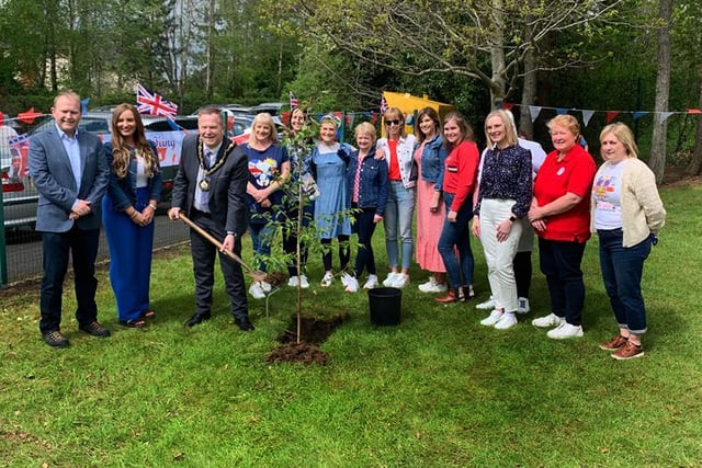Mayor of ABC Council, Councillor Paul Greenfield and chairman of the Board of Governors Mr Gareth Wilson helped the staff and children bury a time capsule and plant a new cherry blossom tree to mark the coronation. The tree was donated to the school by the Rankin Family and the brass plaque, hand made by Matthew Henderson, was also donated to the school PT18-210.