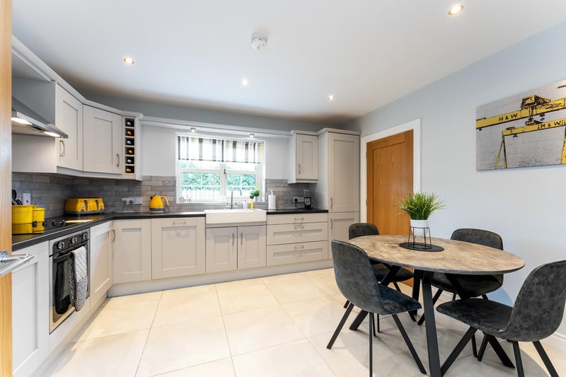 The kitchen has space for casual dining. It also has an attractive and pracitcal tild floor and splashback and recessed lighting.