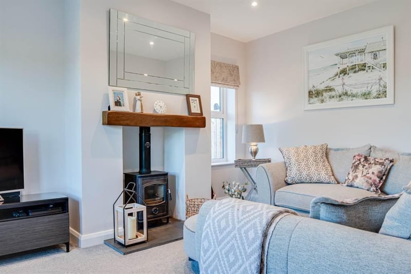 Lounge with cast iron wood burning stove.