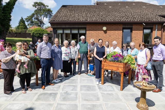 Staff and residents of Stronge House in Portadown, part of the Clanmill Group, celebrating the refurbishment of their home.