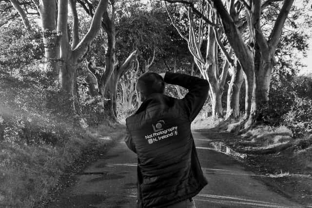 Nathan captures a picture at the Dark Hedges.