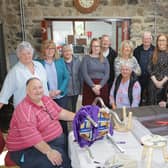 Pictured at the upholstery workshop in The Mill at Cloughmills are members of Cloughmills Community Action Team, Eilish McGarry, Freda McKnight, Wilbert Smyth, Harry Devlin, Eamon O’Toole, Margaret Anne Reid, Gerald Connelly and Muriel Whitten. They are joined by Deirdre Casey, Ballymoney Housing Team, Anna Margaret Jamieson, Workshop Tutor and Jim Whitten, Secretary of Cloughmills Community Action team, Lynsey Quinn, Housing Executive Patch Manager, and Joanne White, Housing Executive Team Leader. Credit NIHE