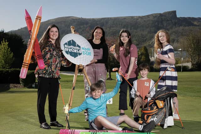 Competition judge and award-winning artist, Kathryn Callaghan and Tourism NI Communications Officer, Claire Hamilton along with budding young artists at the launch of the Giant Welcome Art Competition