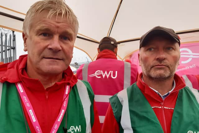 Brian Cummings, a Communications Workers Union rep in Portadown and Colin Mallon, a CWU rep in Lurgan were picketing outside the Royal Mail depot at Highfield Road, Craigavon on Friday. The postal workers are on strike over pay.
