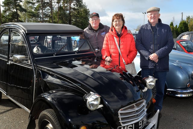 Holt, left, and Marlene McKeown showing off their 1981 Citroen 2CV along with fellow vintage fan, Norman Cooke. PT42-204.