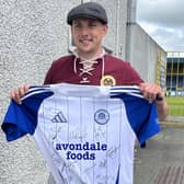 Erzgebirge Aue fan Markus Nebelung with a special souvenir of his visit to Lurgan - a replica top signed by the Glenavon players before the memorable friendly in Lurgan. (Photo by National World)