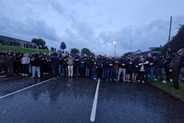 Protesters link arms on the Garvaghy Road, Portadown. It follows a decision by the Parades Commission to permit Portadown Orange District to march through the Garvaghy Road.