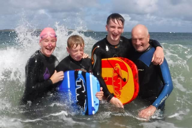 Andrea Harrower, their sons Alex and Fraser and Paddy Harrower who died of pancreatic cancer. Pic credit: NIPANC