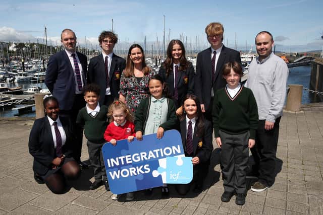 Principal of Bangor Academy, Matthew Pitts; principal of Rathmore Primary School Julie Hardy and Andrew Norrie from the IEF, celebrate their parental ballot success with pupils from both Bangor schools.  Picture: Declan Roughan