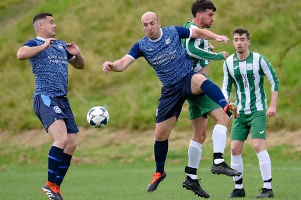 Mayobridge midfielder Miceal Lively contests a high ball with Greenfield Captain James Boyd at Derrybeg Pictures: Brendan Monaghan BM01