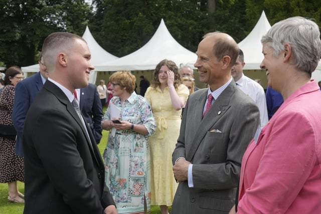 The Duke and DofE CEO Ruth Marvel OBE chat to Award holders at Hillsborough Castle.