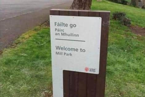 The bi-lingual signpost before it was removed.