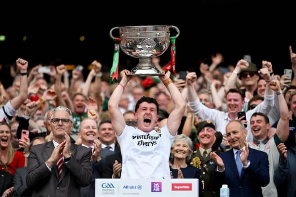 ​Mayo captain Jack Coyne hoists the Sam Maguire after his side ended a 75-year wait by defeating Kerry in the All-Ireland Final on Sunday. Pics: Mayo News / Sportsfile