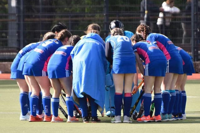 Some of the squad of All Ireland Champions Portadown Ladies Hockey Club U14s in a huddle on the hockey pitch