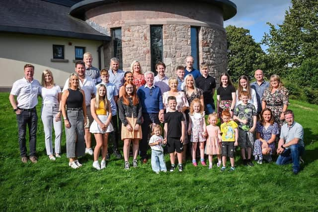 Eugene and Winifred Fullerton, with their six children and respective spouses, and 15 grandchildren.