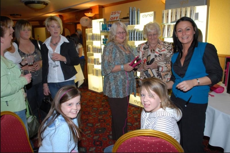 Megan Totten and Laura Scott have their hair styled by Seaneen Copeland of GHD at the Larne roadshow in 2007.