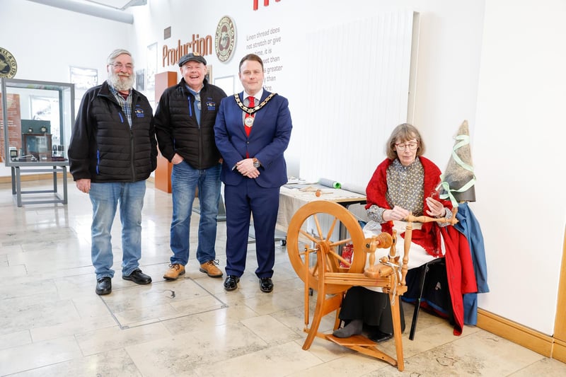 Cllrr Mark Cooper (Mayor of Antrim and Newtownabbey) with Barry Douglas and Pete Haughey from ‘New Town Together Man Shed’ and Rosemary McCartney who is demonstrating the flax spinning wheel on Februrary 15.