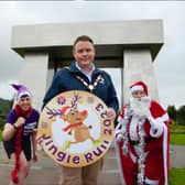 Pictured at the launch of NI Hospice’s 5k and 10k Jingle Run are Annie-Rose Mulholland (NI Hospice), Mayor of Antrim and Newtownabbey, Cllr Mark Cooper and Santa Claus. (Pic: Contributed).