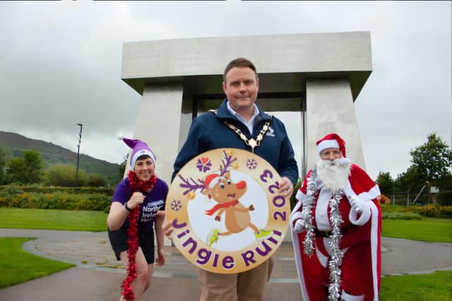 Pictured at the launch of NI Hospice’s 5k and 10k Jingle Run are Annie-Rose Mulholland (NI Hospice), Mayor of Antrim and Newtownabbey, Cllr Mark Cooper and Santa Claus. (Pic: Contributed).