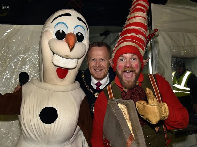 Lord Mayor of ABC Council, Councillor Paul Greenfield pictured with Olaf and one of Santa's elves. LM47-220.