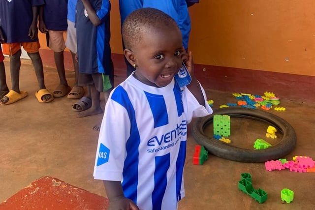 One of the children from Dikka wearing a Coelraine top.