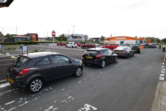 The long queue at the drive-thru at the new Popeyes® in Antrim ahead of its opening on Monday morning. Picture: Kelvin Boyes / Press Eye
