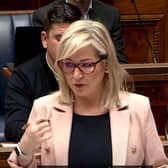 First Minister Michelle O'Neill answering questions on the scandal engulfing her party.