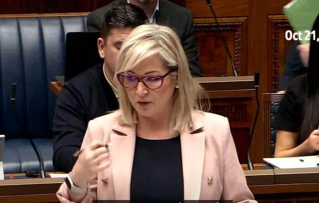 First Minister Michelle O'Neill answering questions on the scandal engulfing her party.