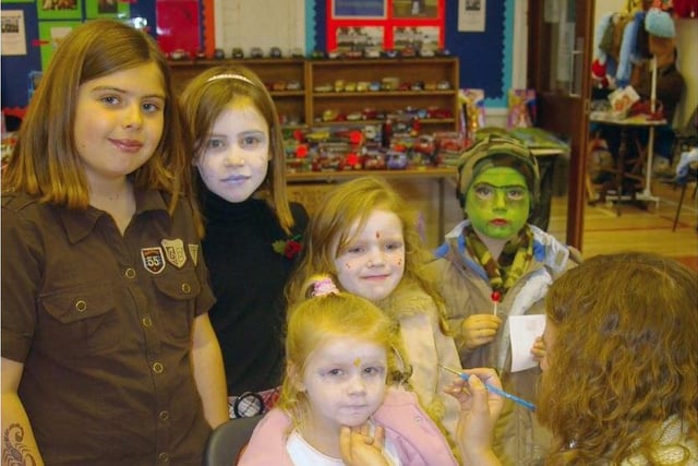 Face painting was among the attractions for younger visitors to the school in 2006. ct46-301fm