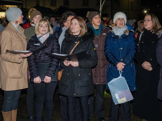 Spreading the Christmas joy through song at the Victorian Street Fair.