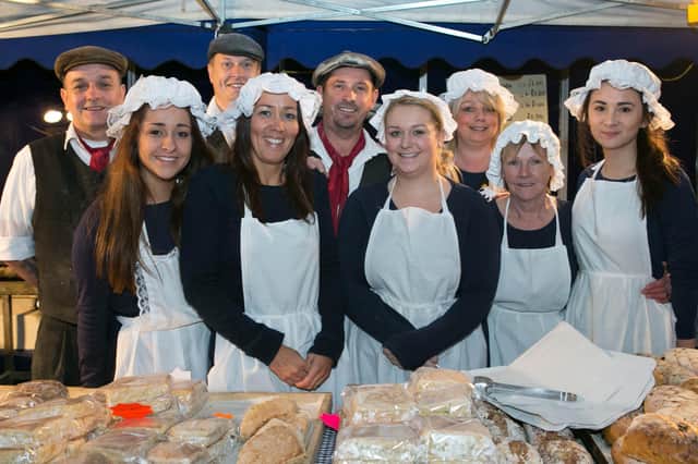 Jason Tweedie pictured with staff members at the 2013 Victorian Street Fair in Whitehead. Photo: RM Studios