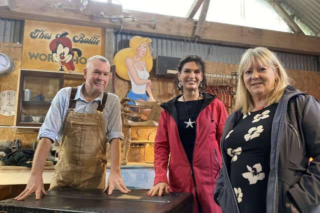 Presenter Lolly Spence (centre) with furniture restorer Brian Bailie and steamer trunk owner Susie Millar during filming for Oul Treasures, coming to BBC One Northern Ireland, Monday 25 March at 10.40pm. Picture: BBC